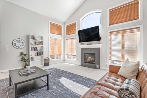 611 Cavendish Beach Bay, Chestermere, AB - Indoor Photo Showing Living Room With Fireplace