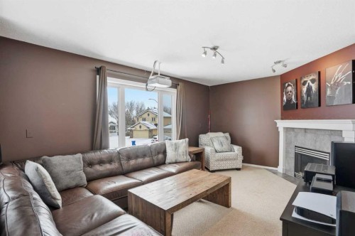 161 Douglas Glen Heath Se, Calgary, AB - Indoor Photo Showing Living Room With Fireplace