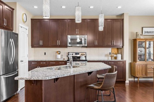 211 Mountainview Drive, Okotoks, AB - Indoor Photo Showing Kitchen With Stainless Steel Kitchen With Upgraded Kitchen