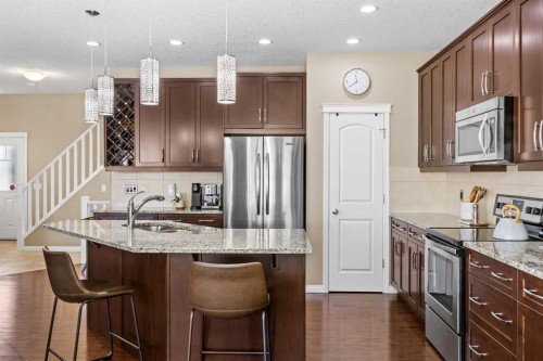211 Mountainview Drive, Okotoks, AB - Indoor Photo Showing Kitchen With Stainless Steel Kitchen With Double Sink With Upgraded Kitchen