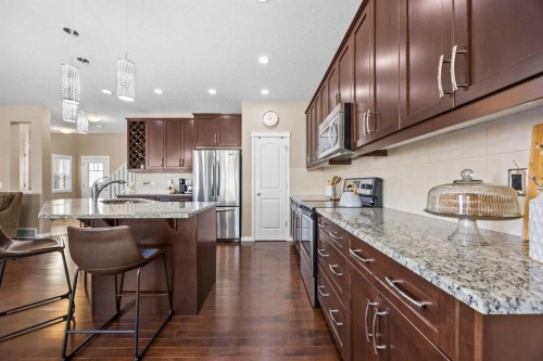 211 Mountainview Drive, Okotoks, AB - Indoor Photo Showing Kitchen With Stainless Steel Kitchen With Upgraded Kitchen
