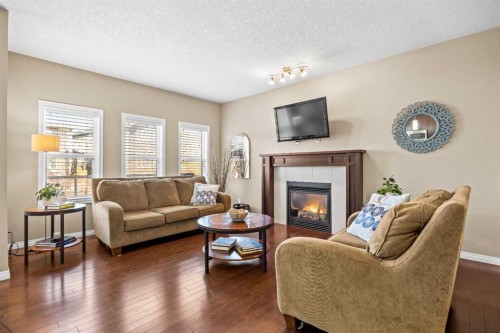 211 Mountainview Drive, Okotoks, AB - Indoor Photo Showing Living Room With Fireplace