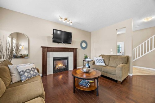 211 Mountainview Drive, Okotoks, AB - Indoor Photo Showing Living Room With Fireplace