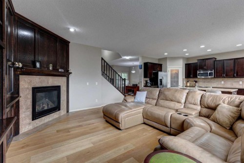 587 Everbrook Way Sw, Calgary, AB - Indoor Photo Showing Living Room With Fireplace