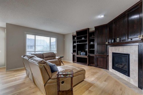 587 Everbrook Way Sw, Calgary, AB - Indoor Photo Showing Living Room With Fireplace