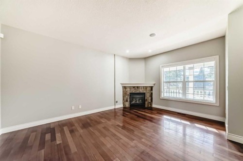 1444 40 Street Sw, Calgary, AB - Indoor Photo Showing Living Room With Fireplace