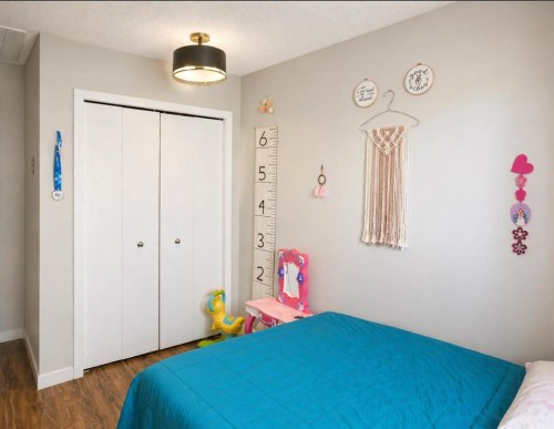 2452 Riverstone Road Se, Calgary, AB - Indoor Photo Showing Bedroom