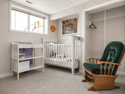 2452 Riverstone Road Se, Calgary, AB - Indoor Photo Showing Bedroom
