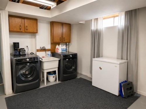 2452 Riverstone Road Se, Calgary, AB - Indoor Photo Showing Laundry Room