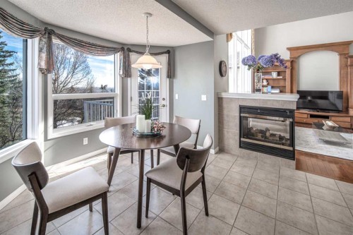 143 Hamptons Terrace Nw, Calgary, AB - Indoor With Fireplace