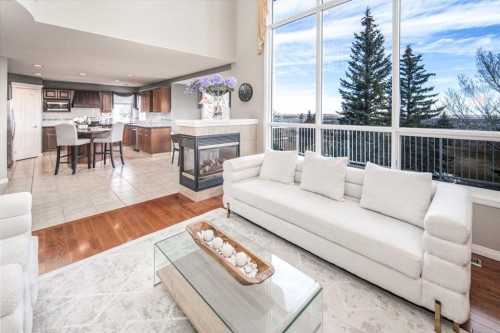 143 Hamptons Terrace Nw, Calgary, AB - Indoor Photo Showing Living Room With Fireplace