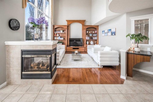 143 Hamptons Terrace Nw, Calgary, AB - Indoor Photo Showing Living Room With Fireplace