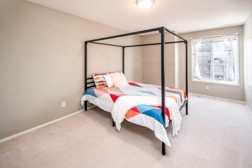 143 Hamptons Terrace Nw, Calgary, AB - Indoor Photo Showing Bedroom