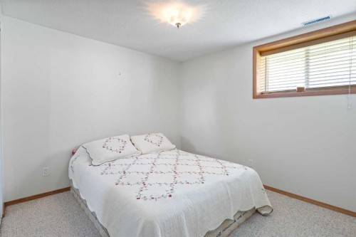 303 De Foras Close Nw, High River, AB - Indoor Photo Showing Bedroom
