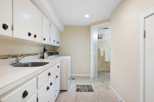 142 Winston Drive Sw, Calgary, AB - Indoor Photo Showing Laundry Room
