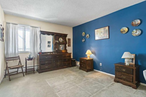 16A-231 Heritage Drive Se, Calgary, AB - Indoor Photo Showing Bedroom
