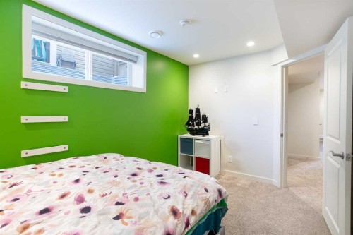 31 Sunset Link, Cochrane, AB - Indoor Photo Showing Bedroom