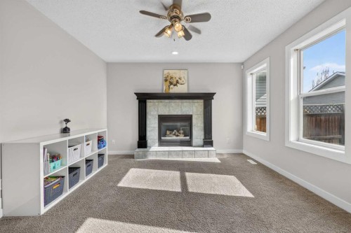 988 Prestwick Circle Se, Calgary, AB - Indoor Photo Showing Living Room With Fireplace