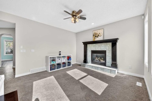 988 Prestwick Circle Se, Calgary, AB - Indoor Photo Showing Living Room With Fireplace