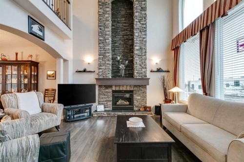 123 Springmere Place, Chestermere, AB - Indoor Photo Showing Living Room With Fireplace