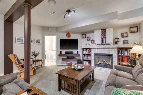 123 Springmere Place, Chestermere, AB - Indoor Photo Showing Living Room With Fireplace