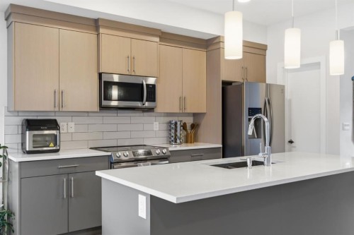 25 Legacy Glen Link Se, Calgary, AB - Indoor Photo Showing Kitchen With Stainless Steel Kitchen With Double Sink With Upgraded Kitchen