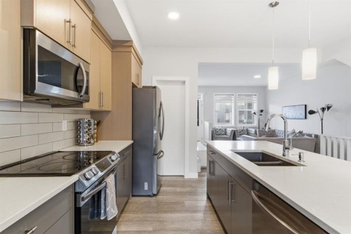 25 Legacy Glen Link Se, Calgary, AB - Indoor Photo Showing Kitchen With Stainless Steel Kitchen With Double Sink With Upgraded Kitchen