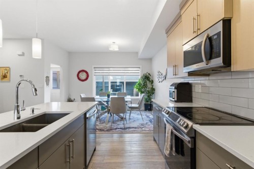 25 Legacy Glen Link Se, Calgary, AB - Indoor Photo Showing Kitchen With Double Sink With Upgraded Kitchen