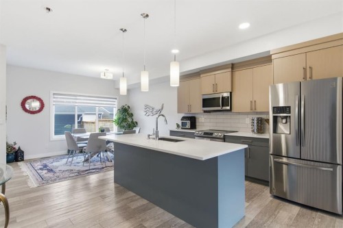 25 Legacy Glen Link Se, Calgary, AB - Indoor Photo Showing Kitchen With Stainless Steel Kitchen With Upgraded Kitchen