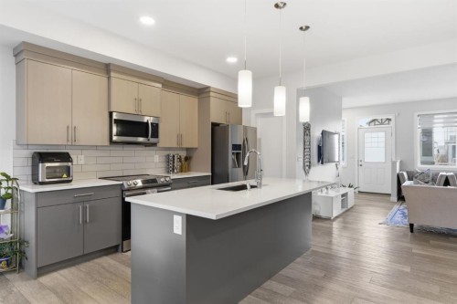25 Legacy Glen Link Se, Calgary, AB - Indoor Photo Showing Kitchen With Stainless Steel Kitchen With Upgraded Kitchen