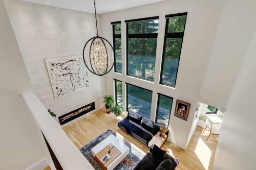 931 Shawnee Drive Sw, Calgary, AB - Indoor Photo Showing Other Room With Fireplace