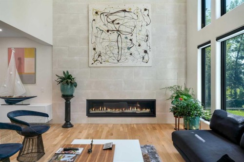 931 Shawnee Drive Sw, Calgary, AB - Indoor Photo Showing Living Room With Fireplace