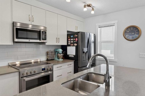 340 Cranbrook Square Se, Calgary, AB - Indoor Photo Showing Kitchen With Stainless Steel Kitchen With Double Sink With Upgraded Kitchen