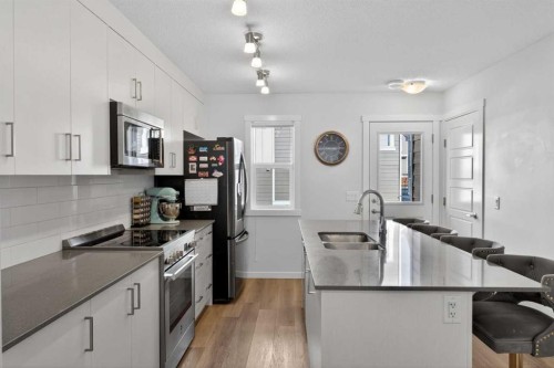340 Cranbrook Square Se, Calgary, AB - Indoor Photo Showing Kitchen With Double Sink With Upgraded Kitchen