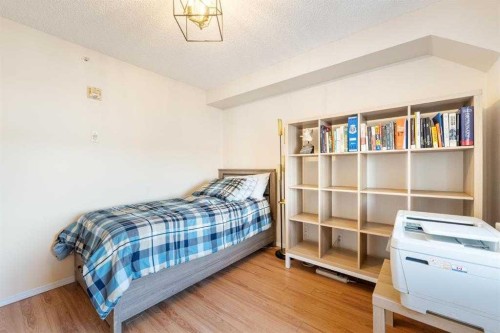 1406-12 Cimarron Common, Okotoks, AB - Indoor Photo Showing Bedroom