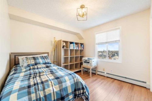 1406-12 Cimarron Common, Okotoks, AB - Indoor Photo Showing Bedroom