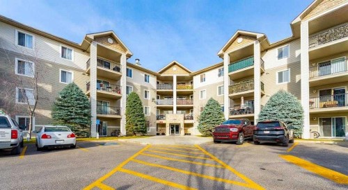1406-12 Cimarron Common, Okotoks, AB - Outdoor With Balcony With Facade