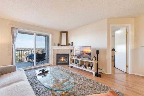 1406-12 Cimarron Common, Okotoks, AB - Indoor Photo Showing Living Room With Fireplace