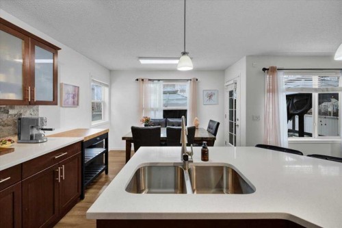 1009 Channelside Way Sw, Airdrie, AB - Indoor Photo Showing Kitchen With Double Sink