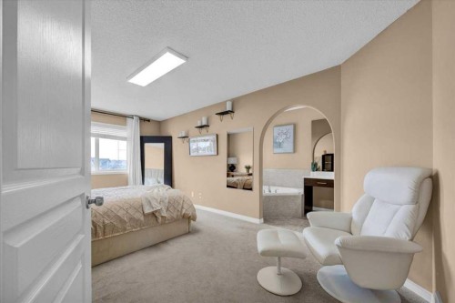 1009 Channelside Way Sw, Airdrie, AB - Indoor Photo Showing Bedroom