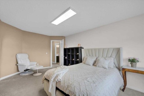 1009 Channelside Way Sw, Airdrie, AB - Indoor Photo Showing Bedroom