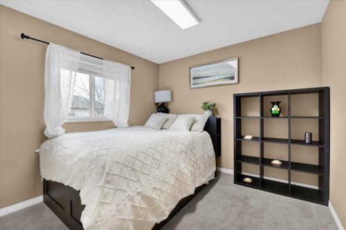 1009 Channelside Way Sw, Airdrie, AB - Indoor Photo Showing Bedroom