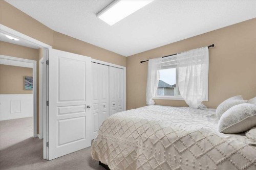 1009 Channelside Way Sw, Airdrie, AB - Indoor Photo Showing Bedroom