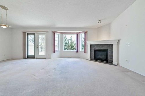 184 Valley Ridge Heights Nw, Calgary, AB - Indoor Photo Showing Living Room With Fireplace