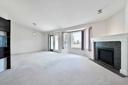 184 Valley Ridge Heights Nw, Calgary, AB - Indoor Photo Showing Living Room With Fireplace