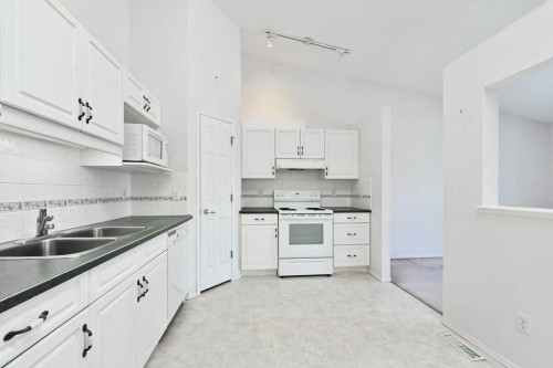 184 Valley Ridge Heights Nw, Calgary, AB - Indoor Photo Showing Kitchen With Double Sink