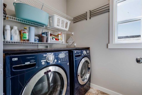 2 Elgin Meadows Green Se, Calgary, AB - Indoor Photo Showing Laundry Room