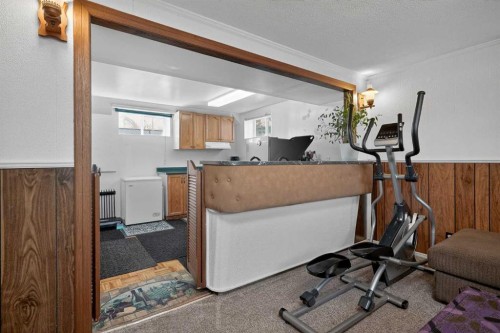 255 Penmeadows Close Se, Calgary, AB - Indoor Photo Showing Gym Room