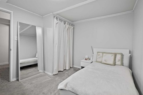 255 Penmeadows Close Se, Calgary, AB - Indoor Photo Showing Bedroom
