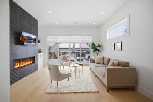 1712 18 Avenue Nw, Calgary, AB - Indoor Photo Showing Living Room With Fireplace